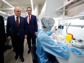 Russian Prime Minister Mikhail Mishustin visits the State Research Centre of Virology and Biotechnology, Vector, which develops EpiVacCorona vaccine against COVID-19 in Novosibirsk, Russia March 5, 2021.
