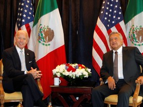 Then-U.S. vice president Joe Biden (L) with Andres Manuel Lopez Obrador, then candidate for president of Mexico, in Mexico City, March 5, 2012.