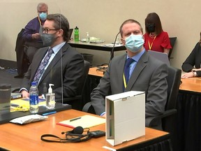 Former Minneapolis police officer Derek Chauvin listens as opening arguments commence in his trial for second-degree murder, third-degree murder and second-degree manslaughter in the death of George Floyd in Minneapolis, Minnesota, U.S.