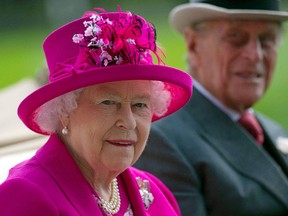 Britain's Queen Elizabeth II (L) and her husband Britain's Prince Philip, Duke of Edinburgh.