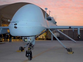 An MQ-1C Gray Eagle drone armed with Hellfire missiles, stands ready to deploy from Camp Taji, Iraq, in this US Army handout taken on February 27, 2011.