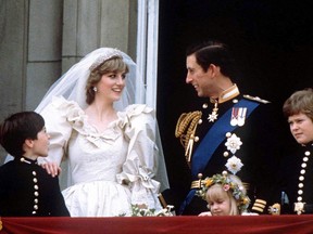 Prince Charles and Princess Diana stand on the balcony of Buckingham Palace in London, following their wedding at St. Pauls Cathedral, June 29, 1981.