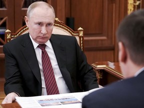 Russian President Vladimir Putin meets with Novgorod Region Governor at the Kremlin in Moscow on March 24, 2021.