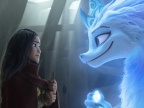 Raya (voiced by Kelly Marie Tran) and Sisu (Awkwafina) in Raya and the Last Dragon.