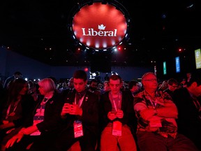 Delegates text at a Liberal convention in Winnipeg in a file photo from May 27, 2016. The Liberal party is holding a remote policy convention April 8 -10, while the NDP are also holding a remote policy convention, April 9 - 11.
