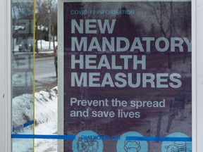 An Alberta sign announcing new health measures in Edmonton in December.