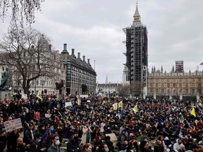 Protestors hold placards during a 'Kill The Bill' protest against the Government's Police, Crime, Sentencing and Courts Bill, in Parliament Square, central London on April 3