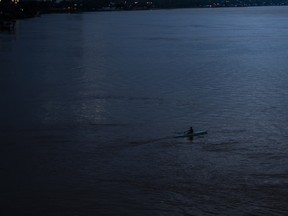 A person kayaks through the Parana River in Rosario, Argentina, on  April 23