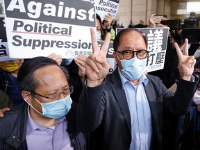 Pro-democracy activists Albert Ho and Yeung Sum leave court after receiving suspended sentences for unauthorized assembly, in Hong Kong, China, on April 16, 2021.