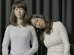 Ann Shin (at right) poses with Erica, robot creation of Hiroshi Ishiguru.