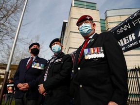 Veterans are seen outside the court ahead of a trial of former two British soldiers for the murder of IRA commander Joe McCann in 1972 in Belfast.