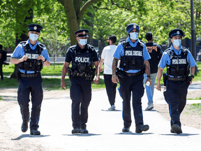Toronto police and special constables patrol Trinity Bellwoods Park during the COVID pandemic in May 2020.