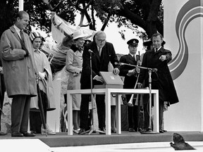 Prince Philip, left, and Queen Elizabeth greet  Manitoba Beaver as peaks out of his box at a July 14, 1970 ceremony in which Hudson's Bay Company observe an old tradition.