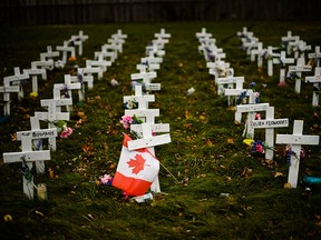 Crosses are displayed in memory of the elderly who died from COVID-19 at the Camilla Care Community facility during the COVID-19 pandemic in Mississauga, Ont., on Nov. 19, 2020.