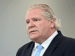 Ontario Premier Doug Ford answers questions from the media at a mass COVID-19 vaccination site in Toronto on Tuesday, April 6, 2021.
