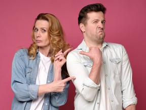 Stressed man and woman sister and brother pointing with finger at each other. They blame and accuse one another