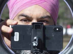 NDP Leader Jagmeet Singh, shown adjusting his webcam, says his party's focus on making the ultra-rich pay 'their fair share distinguishes the NDP from the Liberals.