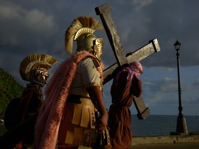 Catholic devotees re-enact the passion of the Christ during Holy Week, on March 31, 2021, in Mulanay, Philippines.