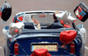 Prince William drives an Aston Martin as he leaves the Buckingham Palace with his wife Kate, Duchess of Cambridge, after their wedding on April 29, 2011 in London.