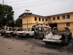 Burnt vehicles are seen outside the Nigeria police force Imo state command headquaters after gunmen attacked and set properties ablaze in Imo State, Nigeria