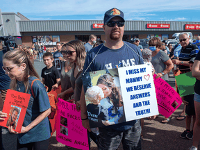 Nick Beaton, whose wife Kristen was killed in the April 2020 mass shooting, attends a march in Bible Hill, N.S. organized by families of victims last summer demanding an inquiry into the crimes that killed 22 people.