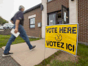 A resident arrives to vote in the New Brunswick provincial election at St. Mark's Catholic Church in Quispamsis, on Sept. 14, 2020, during the COVID-19 pandemic.
