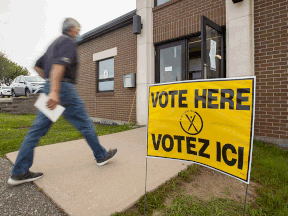 A resident arrives to vote in the New Brunswick provincial election at St. Mark's Catholic Church in Quispamsis, on Sept. 14, 2020, during the COVID-19 pandemic.