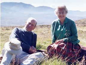 In a photograph released by Buckingham Palace on April 16, 2021, Queen Elizabeth and Prince Philip are seen in a photo taken by the Countess of Wessex in Scotland in 2003. Philip's funeral is on Saturday, April 17 (10 a.m. ET in Canada).