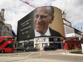 The electronic billboard at Piccadilly Circus displays a tribute to Britain's Prince Philip, Duke of Edinburgh in central London on April 9, 2021 after the announcement of the duke's death.