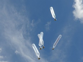 South Korean activists launch balloons to send some 100,000 anti-North Korea leaflets into North Korea at Imjingak, in Paju near Korea border on July 2010