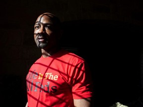 Wearing a T-shirt he designed himself, Kendrick Fulton, who was released to home confinement due to the COVID-19 pandemic, poses for a photo in Round Rock, Texas, U.S., April 8, 2021.