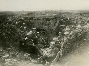 Canadian soldiers are photographed in a captured German machine-gun emplacement during the Battle of Vimy Ridge, April 1917.