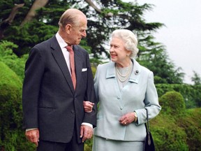 Britain's Queen Elizabeth II and her husband, Britain's Prince Philip, Duke of Edinburgh (L) walking at Broadlands, Hampshire in 2007.