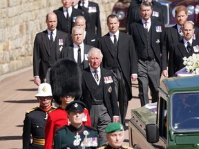 Prince Charles, Prince of Wales, Prince Andrew, Duke of York, Prince Edward, Earl of Wessex, Prince William, Duke of Cambridge, Peter Phillips, Prince Harry, Duke of Sussex, Earl of Snowdon David Armstrong-Jones and Vice-Admiral Sir Timothy Laurence follow Prince Philip, Duke of Edinburgh's coffin during the Ceremonial Procession of the funeral of Prince Philip, Duke of Edinburgh at Windsor Castle on April 17, 2021 in Windsor, England.