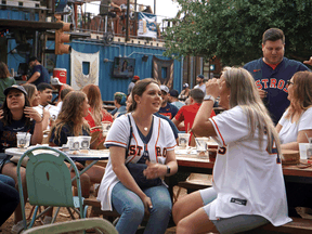 Customers gather at a beer garden in Houston, Texas, on April 9, 2021. Texas abandoned all restrictions whatsoever at the beginning of March and COVID cases and deaths have been dropping since.