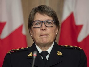 RCMP Commissioner Brenda Lucki listens to a question during a news conference in Ottawa, Wednesday October 21, 2020.
