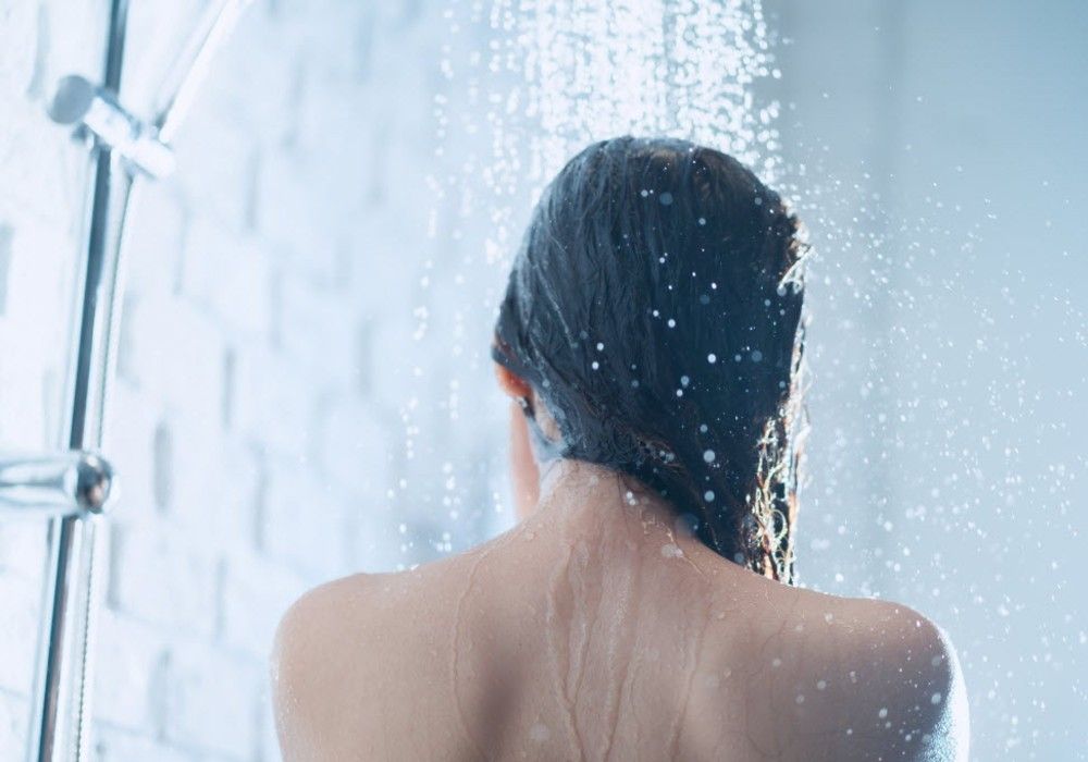 Scaling back on hot, soapy showers could be good for our health ...