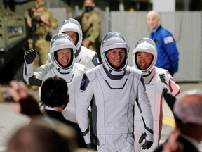NASA astronauts Shane Kimbrough and Megan McArthur, JAXA astronaut Akihiko Hoshide and ESA astronaut Thomas Pesquet arrive for the boarding of the SpaceX Falcon 9 rocket with the Crew Dragon capsule, before the launch of the NASA commercial crew mission at Kennedy Space Center in Cape Canaveral, Florida, U.S., April 23, 2021.
