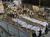 Security officials and rescuers gathering around the corpses of victims who died in a stampede overnight during a religious gathering in Meron in northern Israel, April 30, 2021.