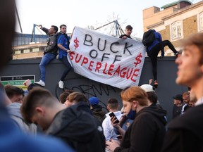 Chelsea fans hold a banner outside the stadium before the match after reports suggest they are set to pull out of the European Super League. It was announced twelve of Europe's top football clubs will launch a breakaway.