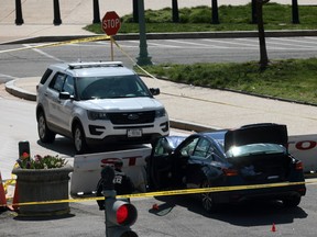 Law enforcement investigate the scene after a vehicle charged a barricade at the U.S. Capitol on April 2, 2021 in Washington, DC.