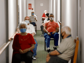 Residents a Toronto seniors residence wait on their second dose of the Pfizer COVID-19 vaccine on April 1, 2021.
