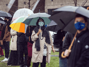 People line up at a COVID-19 vaccine pop-up clinic at a Toronto mosque on Sunday, April 11, 2021.