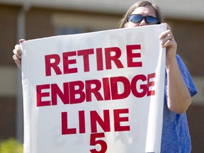 A woman takes part in a protest against Enbridge's Line 5 pipeline in Holt, Mich., in 2017.