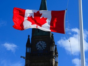 A Canada flag is pictured in this file photo of Peace Tower on Parliament Hill in Ottawa on Monday, April 12, 2021.