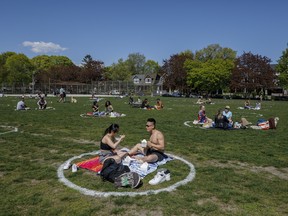 People use social distancing circles at Trinity-Bellwoods park in Toronto, Thursday, May 13, 2021.