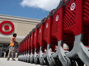 A Target store employee collects shopping carts to bring back into the store on August 21, 2019 in Pembroke Pines, Florida.