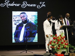 Jha'rod Ferebee (L) and Khalil Ferebee speak during the funeral for their father Andrew Brown Jr. at the Fountain of Life church on May 03 in Elizabeth City, North Carolina