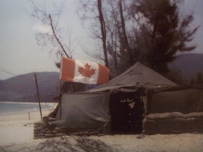 The Canadian flag flying proudly from a U.S. Army tent during the Vietnam war. It was put there by Staff Sergeant Mike Male, a Canadian who enlisted with U.S. forces in order to serve in Indochina, and had his Canadian citizenship stripped as a result.