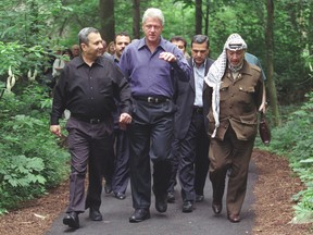 From left, Ehud Barak, Bill Clinton and Yasser Arafat at Camp David.